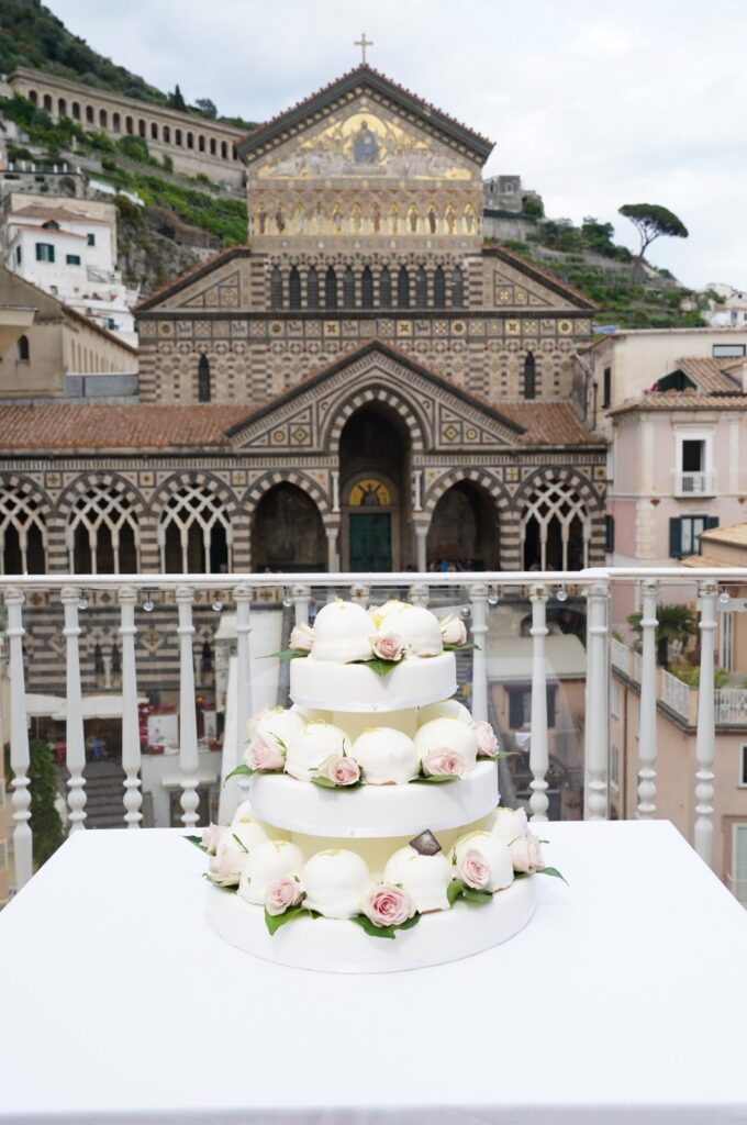 Artisanal cake from Pansa Pastry Shop with a view of the Duomo of Amalfi